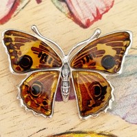 Sterling Silver Pendant Beautiful amber butterfly which has undergone a specialist carving and pressure treatment to create a dramatic realistic effect